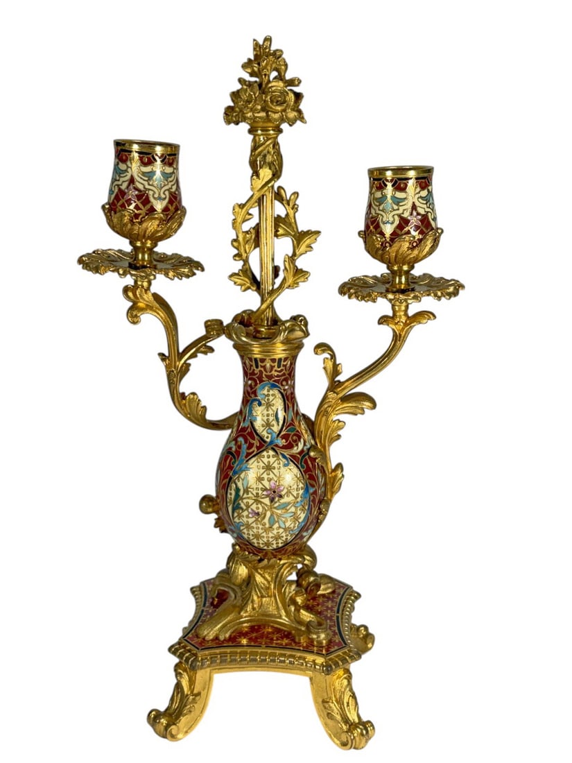 French Gilt Bronze Champleve Enamel Candelabra: Antique French finely cast three light candelabra featuring elaborate champleve enamel high quality decoration. The central baluster form body is richly adorned with polychrome enamel in red blue crea