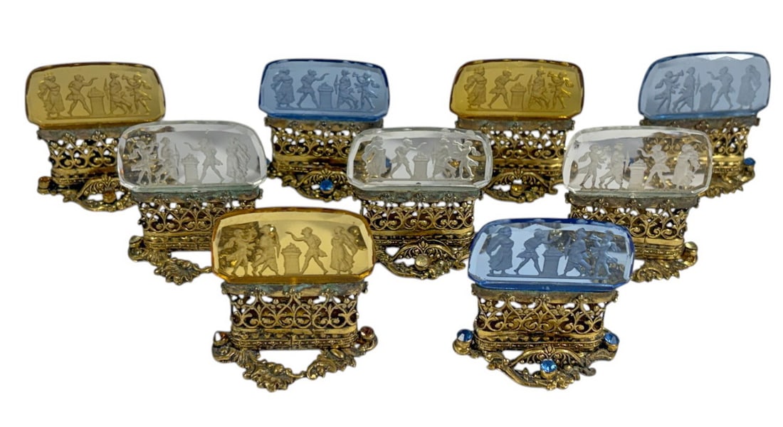 Gilt metal & Embossed Glass Card Holders 9pc LOT: Antique collection ofnine figural card holders featuring intaglio cut glass panels in assorted blue, amber & clears colors. Each glass panel is carved with classical scenes depicting figures in neocla