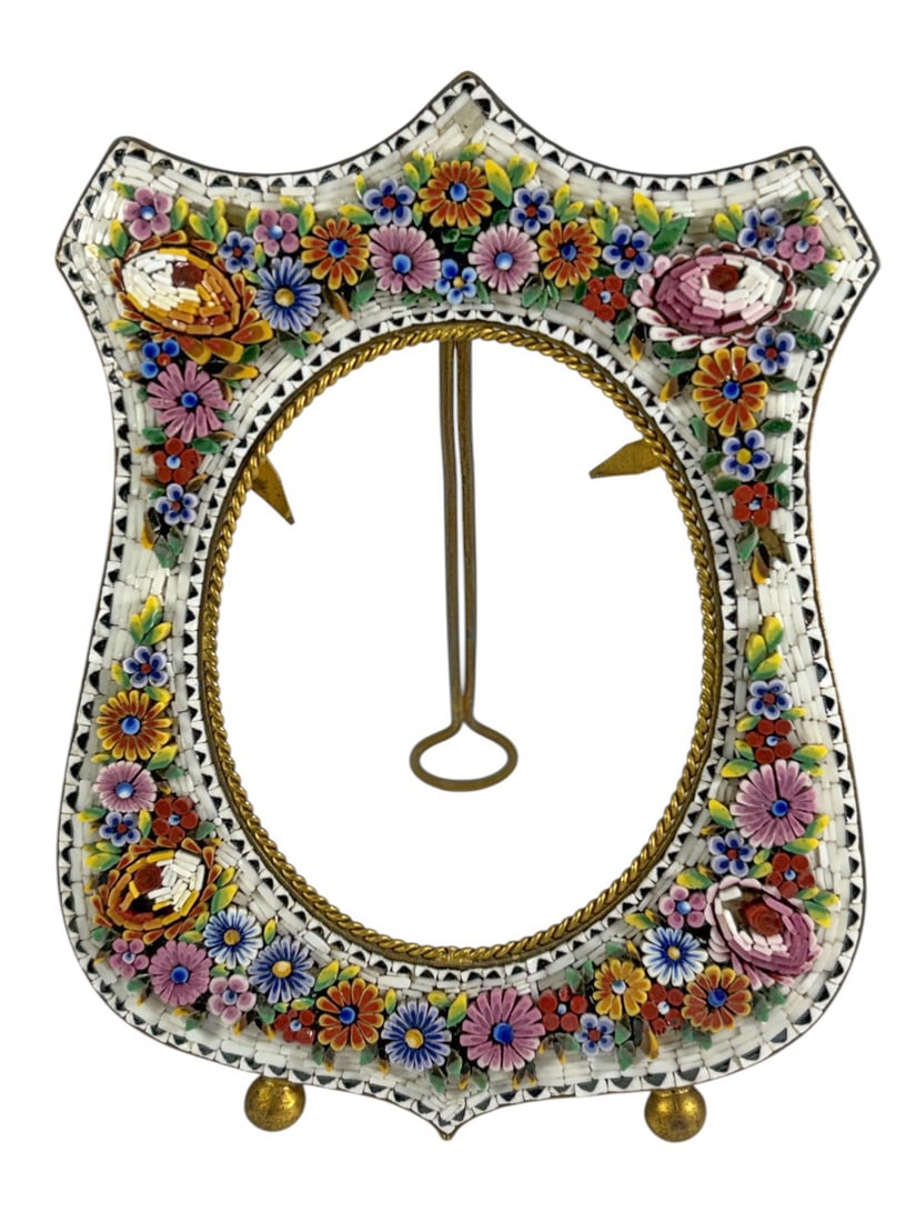 VTG Italian Gilt Brass Micromosaic Picture Frame: Italian gilt brass ornate micro mosaic picture frame featuring a richly floral motif composition. The design displays an array of blossoms in pink, blue, yellow and red toneson a white background. The