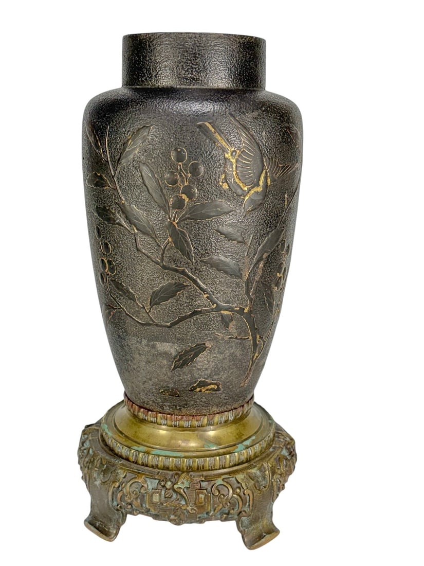 Japanese Iron Vase on 19th C Bronze Base 15.5': Japanese style iron vase with textured surface and relief bird among flowering branches, traces of gilt on dark patina, mounted on ornate bronze base with scrolling motifs, base 19th century, vase lik