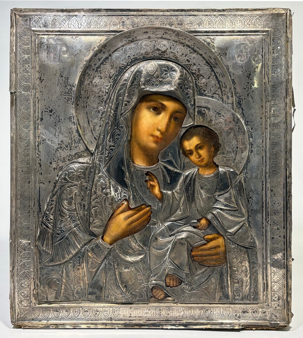 Imperial Russian 84 Silver Mother of God Icon: Russian Orthodox icon of the Mother of God with Christ Child, Kazan Smolensk type, with MP and OU monograms, silver oklad with repousse floral decoration and niello, hallmarked 84 zolotnik, circa 1870