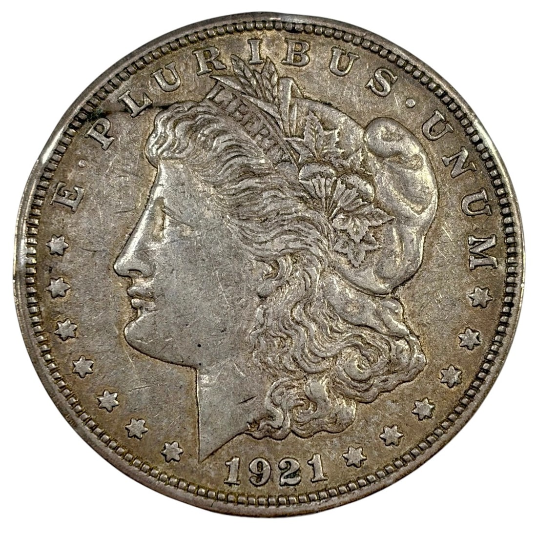 1921 D Morgan Silver Dollar Coin Minted in Denver: United States Mint, Morgan silver dollar dated 1921 Denver, approximately 1.5 inches diameter, 26.7 grams, circulated, 90 percent silver, final year of issue. Condition: Good overall condition having 