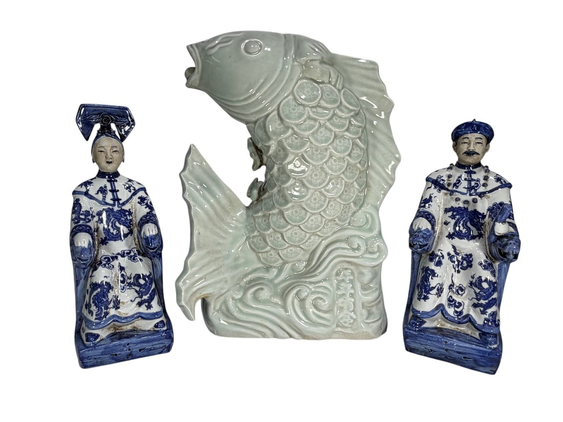 Glazed Porcelain Fish & Pair of Figures 3pc LOT: Three piece lot including a celadon style glazed porcelain fish form vase with incised mark to the body, and two blue and white porcelain figural sculptures, both with marks to the base. Mixed ceramic