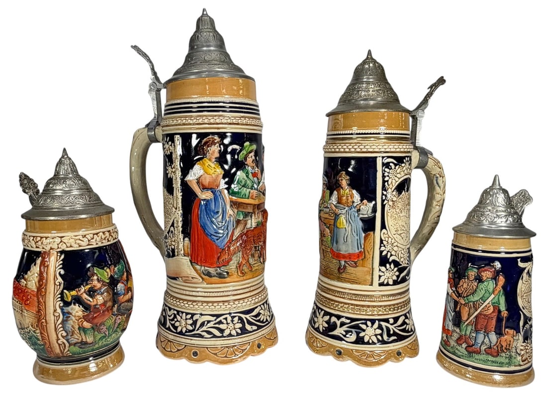 German Pottery Beer Stein Music Boxes 4pc LOT: German pottery, group of four beer steins including two with music box mechanisms, all with relief decoration and pewter lids. The largest measures approximately 13.5 inches tall by 6 inches wide by 6