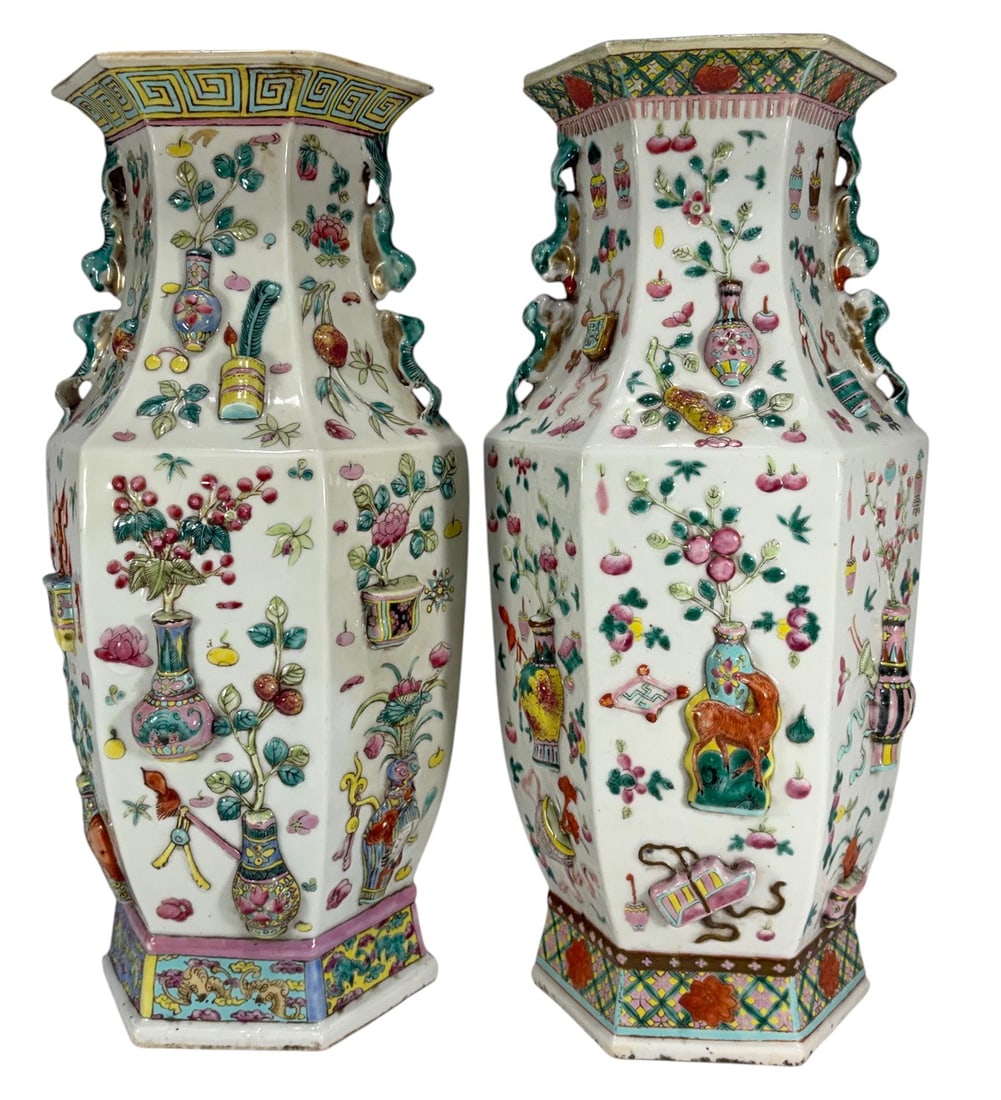 Antique Chinese Famille Rose Hexagonal Vases 2pc: Chinese, pair of antique famille rose porcelain hexagonal vases with polychrome enameled decoration of floral, figural, and auspicious motifs, paneled sides with handles, unglazed bases. Each piece me
