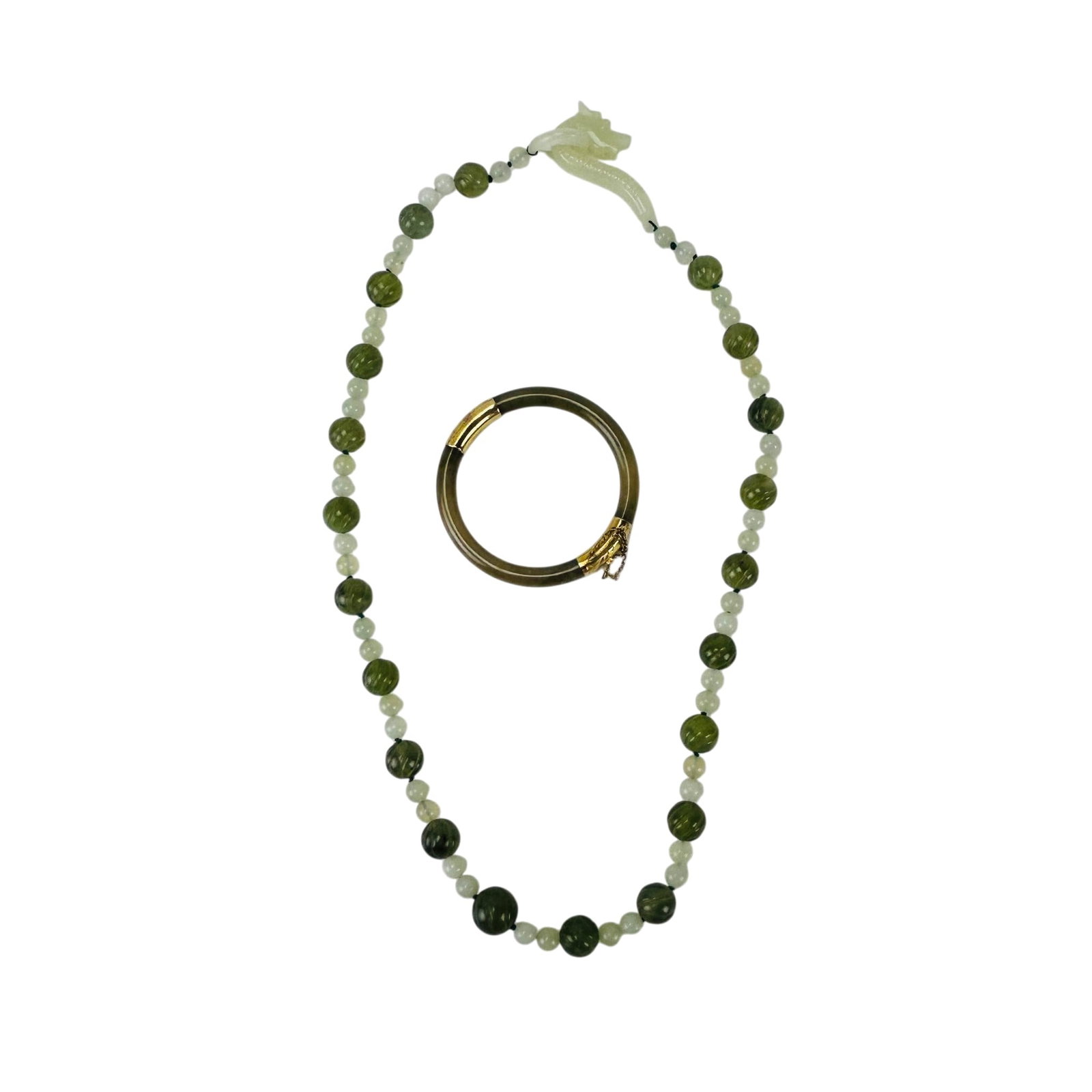 Chinese Jade Necklace & Bracelet w/ 14K Gold Clasp: Chinese green celadon jade semiprecious gemstone jewelry items, lot of two. Includes a beaded necklace with alternating light and darker colored beads having a carved dragon form clasp. Accompanied wi