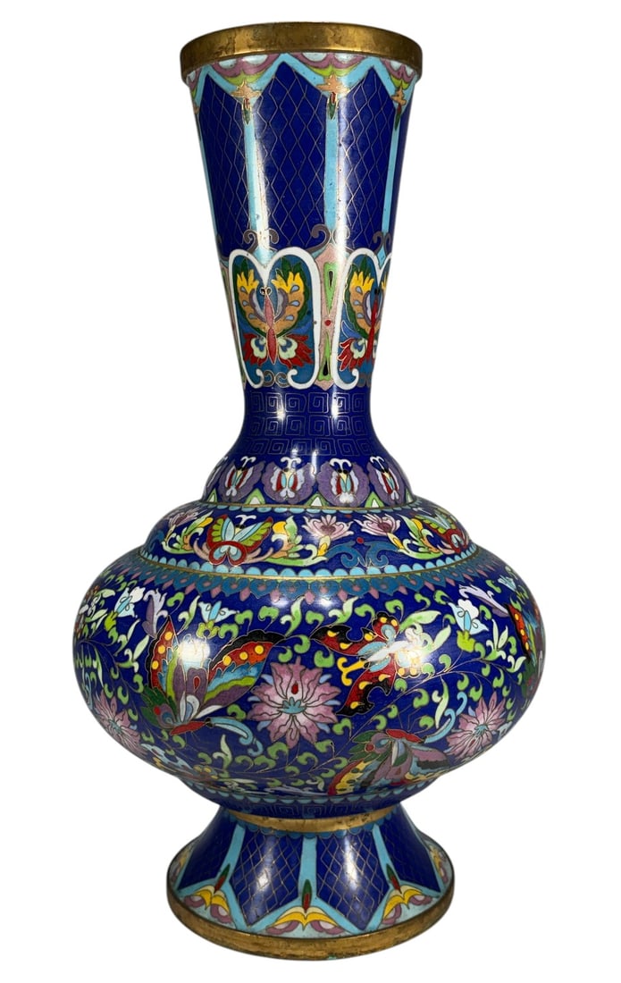 20th Century Chinese Cloisonne Enamel Vase 15": Chinese cloisonne enamel vase, baluster form, cobalt blue ground, butterfly and floral motifs, polychrome decoration, geometric neck and foot, gilt rims, 20th century decorative work. Dimensions: 15 X