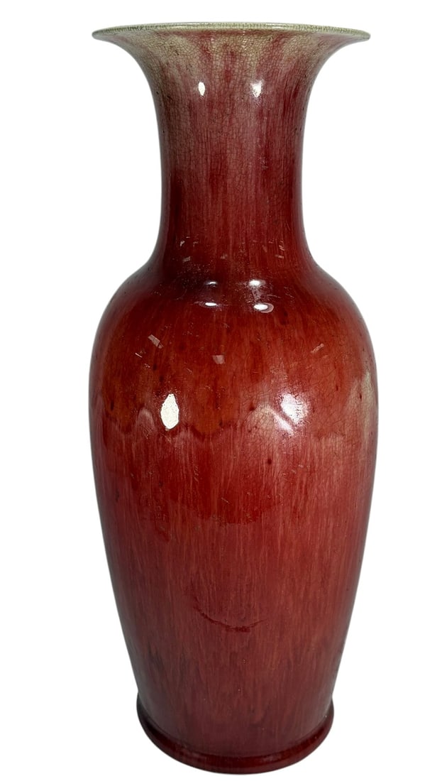 Large Chinese Oxblood Glazed Ceramic Vase 22.75": Large Chinese oxblood glazed ceramic vase, baluster form with flared trumpet rim, deep red glaze with lighter pooling and cream toned rim, natural crackle throughout, classic monochrome ceramic design