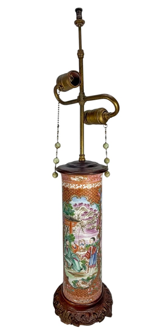 Chinese Famille Rose Vase Mounted As Lamp: Chinese famille rose porcelain table lamp, cylindrical form decorated with figural court scenes in landscape reserves, framed by geometric and floral borders, mounted with brass double socket cluster,
