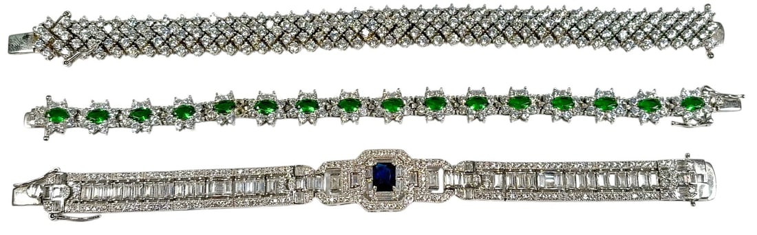 Sterling Silver & Other Gem-Set Bracelets 3pc LOT: Lot of two sterling silver 925 and one silver-plated bracelet, each with distinct design and gemstone accents including green, clear, and blue stones. The largest bracelet measures approximately 7.5 x