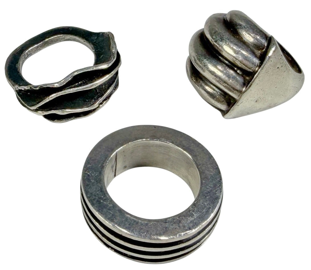 Modernist Sterling Silver Rings 3pc LOT 40.5 grams: Lot of three sculptural modernist sterling silver rings. To include: a signed Ina Hohensee oxidized 'Organic Wave' ring, a vintage asymmetrical dome ring with deep grooves, and a heavy Mexican silver 
