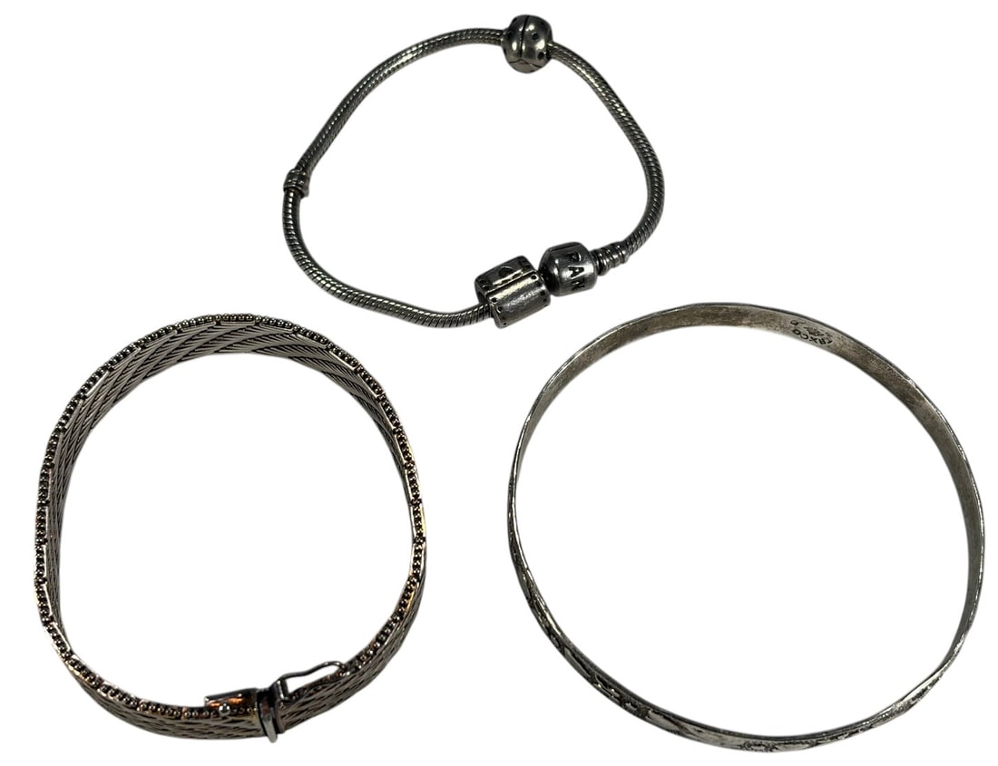 Sterling Silver 925 Bracelets, 62 grams, 3pc LOT: Three-piece lot of sterling silver 925 bracelets including a Pandora charm bracelet with snake chain and barrel clasp, a Mexican silver bangle bracelet marked Taxco with engraved motifs, and a woven m