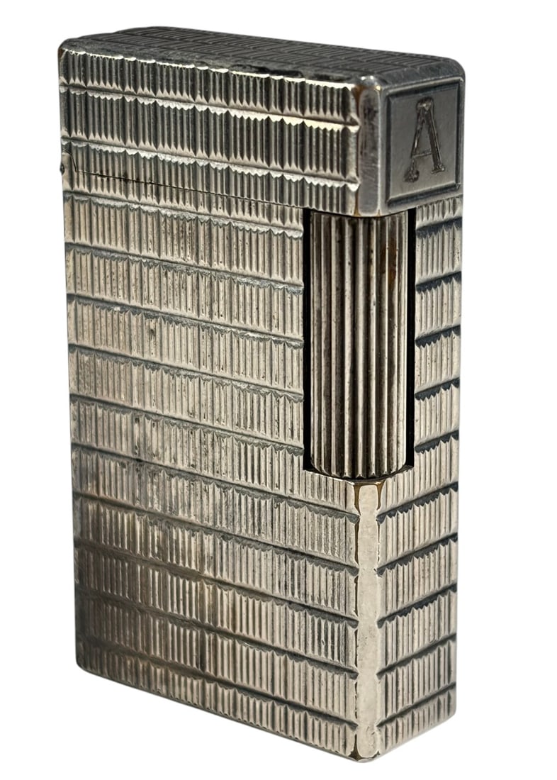 S.T. Dupont Silver Tone Lighter Made In France: S.T. Dupont silver tone lighter, Ligne 1 style with vertical line pattern and personalized 'A' cartouche, rectangular form with fluted roller striker and hinged lid, underside is marked 'S.T. Dupont P