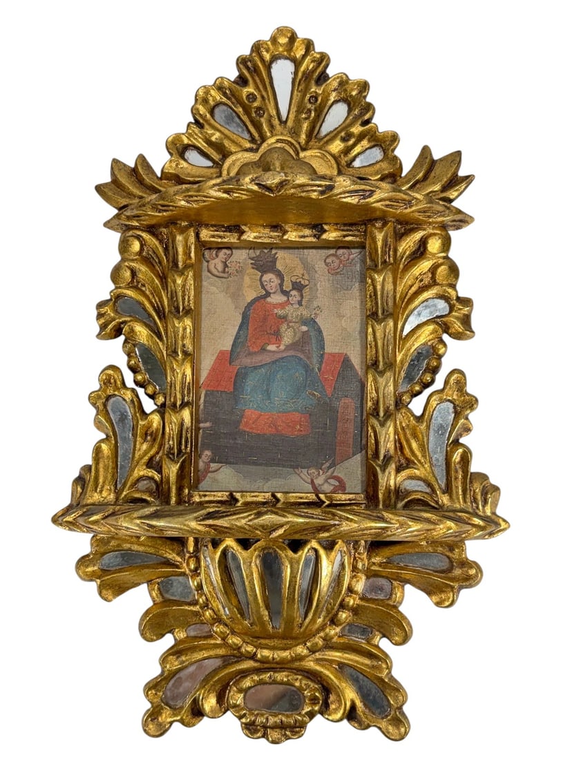 Cuzco, Peru Religious Oil Painting on Canvas: Religious Cuzco, Peru style oil painting on canvas depicting Madonna and Child with angels. Presented in an ornate frame designed like a small altar, featuring two shelf-like ledges. The frame shows g