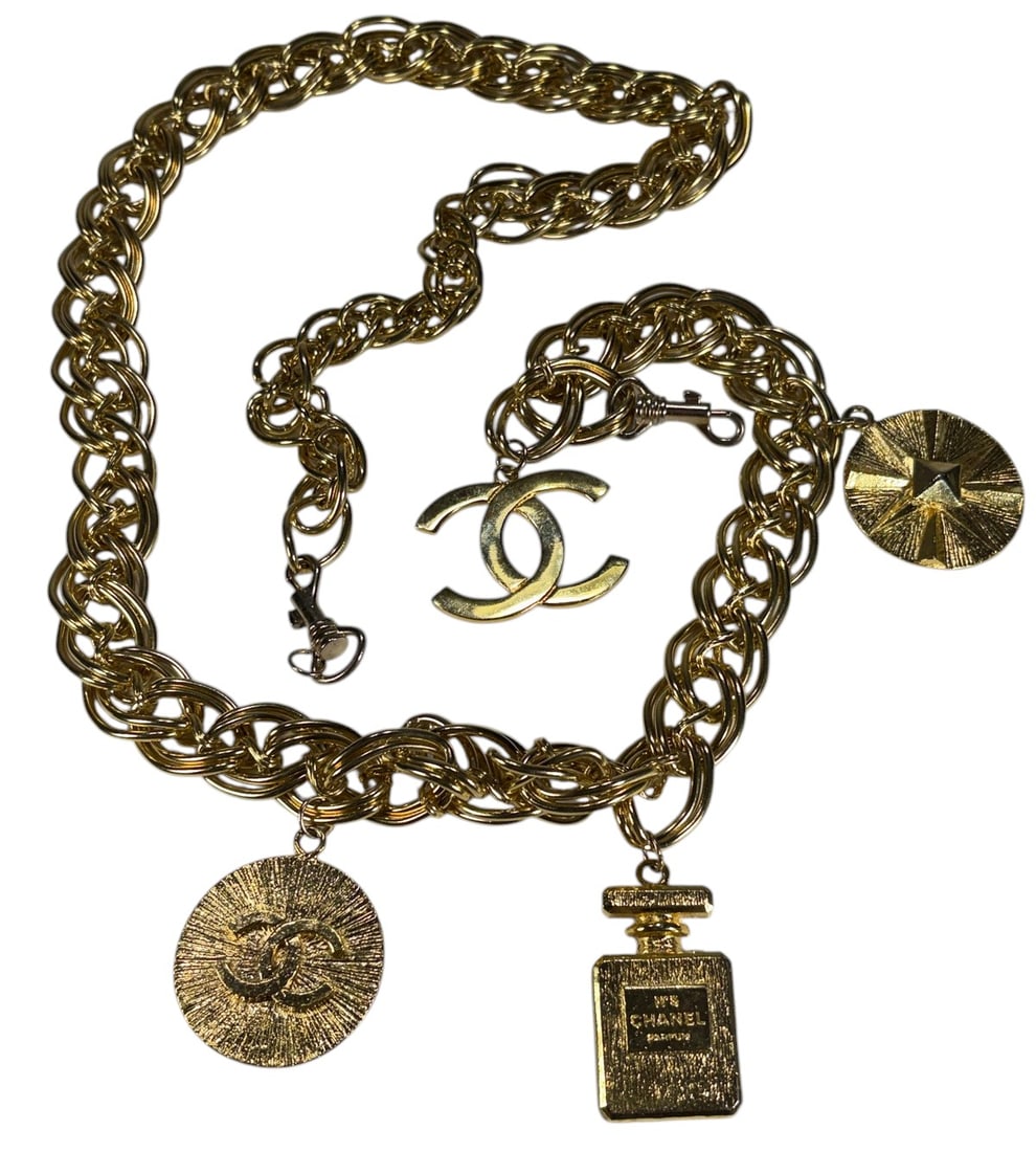 Chanel Style Gold Tone Handbag Chain Strap: Chanel style gold tone chain strap with oversized interlocking links and four hanging charms including double C motifs, No. 5 bottle, and medallion accents, some with hallmark-style marks, slight vari