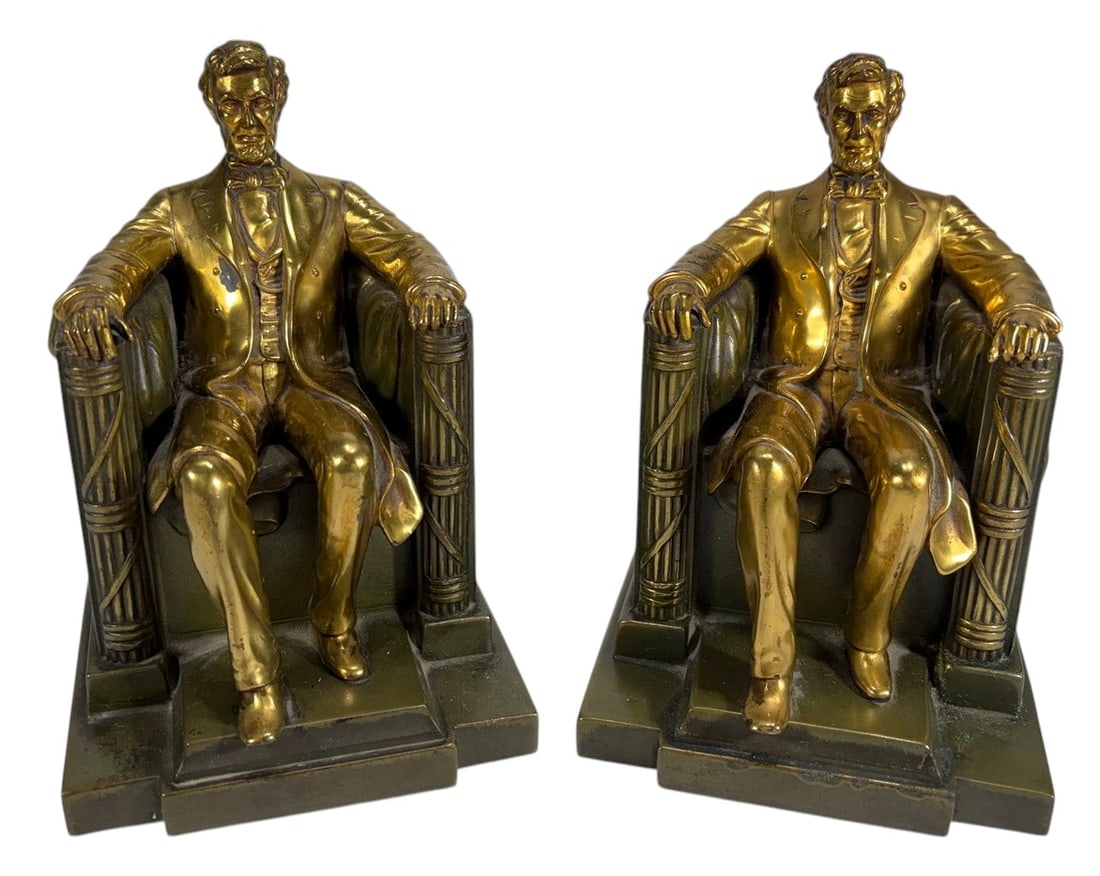 Abraham Lincoln Tomb Spelter Bookends, Pair: Abraham Lincoln tomb spelter bookends, pair, each modeled as seated Lincoln in high back chair after the Lincoln Memorial sculpture by Daniel E French, with stepped rectangular bases and draped chair