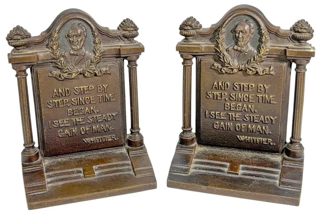 Bradley & Hubbard Lincoln Iron Bookends 2pc LOT: Cast iron figural bookends depicting Abraham Lincoln in relief bust within a classical architectural frame, flanked by columns and topped with urn finials, each inscribed with a quotation, 'And step b