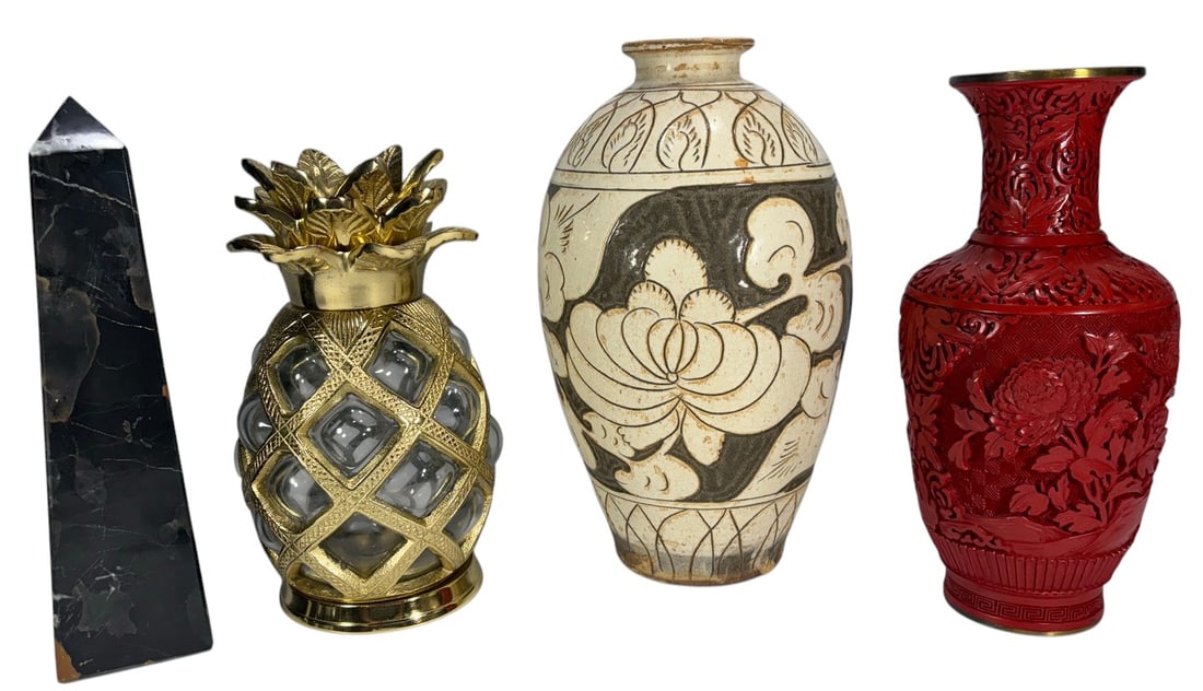 Mixed Decorative Vases & Marble Obelisk 4pc LOT: Includes one black marble obelisk, one brass and glass pineapple candle lamp, one Chinese Cizhou style stoneware vase, and one red Chinese carved or lacquer style vase with brass rim and base. The tal