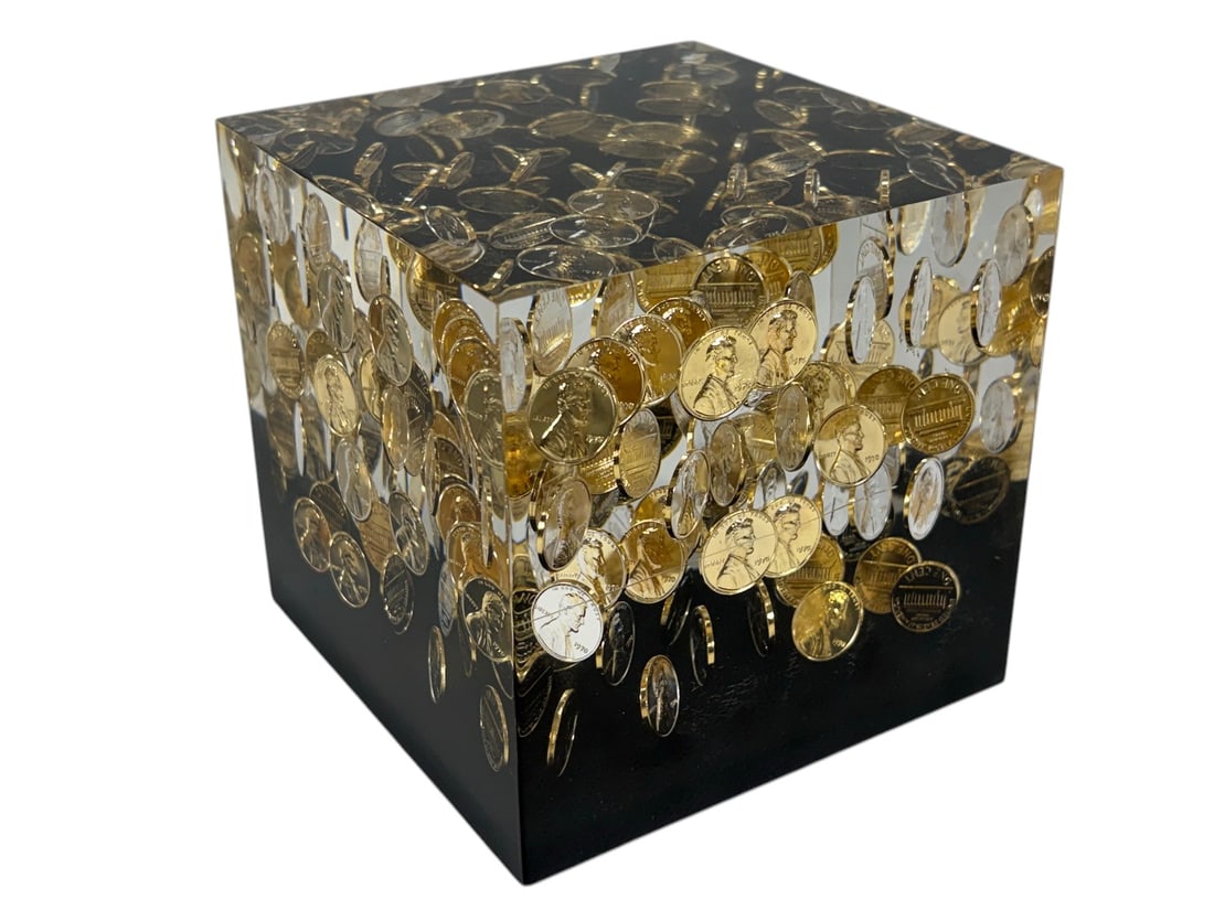 1970 Lincoln One Cent Coins Acrylic Cube Sculpture: Acrylic resin cube with embedded 1970 Lincoln one cent coins, clear and black block, suspended cascading design, coins visible on all sides, modern decorative sculptural desk piece. Dimensions: 4.75 X