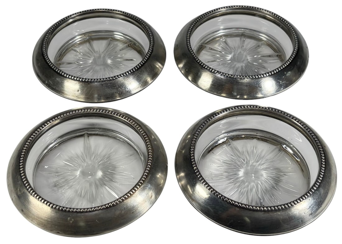 Sterling Silver & Glass Circular Ashtrays 4pc LOT: Group of four ashtrays with clear glass inserts and sterling silver (.925) mounts. Each features a circular form with beaded rim detail and cut glass centers. Marked 'Wm. Whiting & Co. Sterling,' with