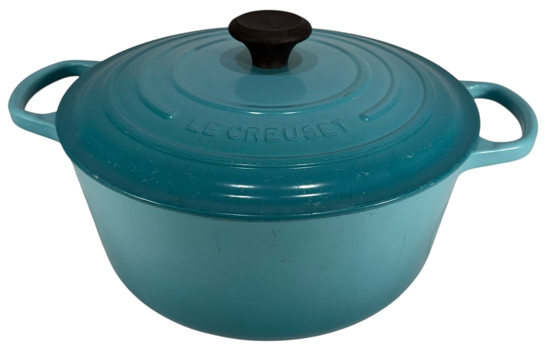 Le Creuset Enameled Cast Iron Dutch Oven w/ Lid: Le Creuset enameled cast iron Dutch oven with lid, round form, red gradient exterior and cream interior, stainless steel knob, dual side handles, marked size 26, 6 1/2 qt, Made in France. Dimensions: 