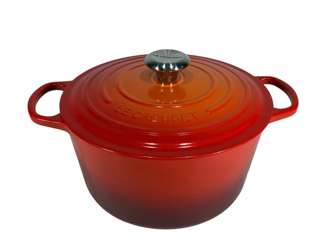 Le Creuset Round Enameled Cast Iron Pot with Lid: Enameled cast iron pot with lid by Le Creuset. Round form with integrated side handles and matching lid featuring a black knob, both marked. Interior finished in light enamel. Base is stamped 'France'