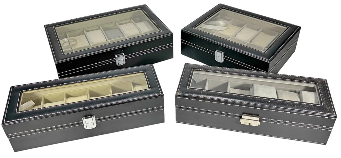 Assorted Watch Storage Display Cases 4pc LOT: Group of four watch storage cases. Each features a transparent lid, silver-tone metal hardware, and stitched exterior. Faux leather finish with light-colored interiors and padded compartments for hold