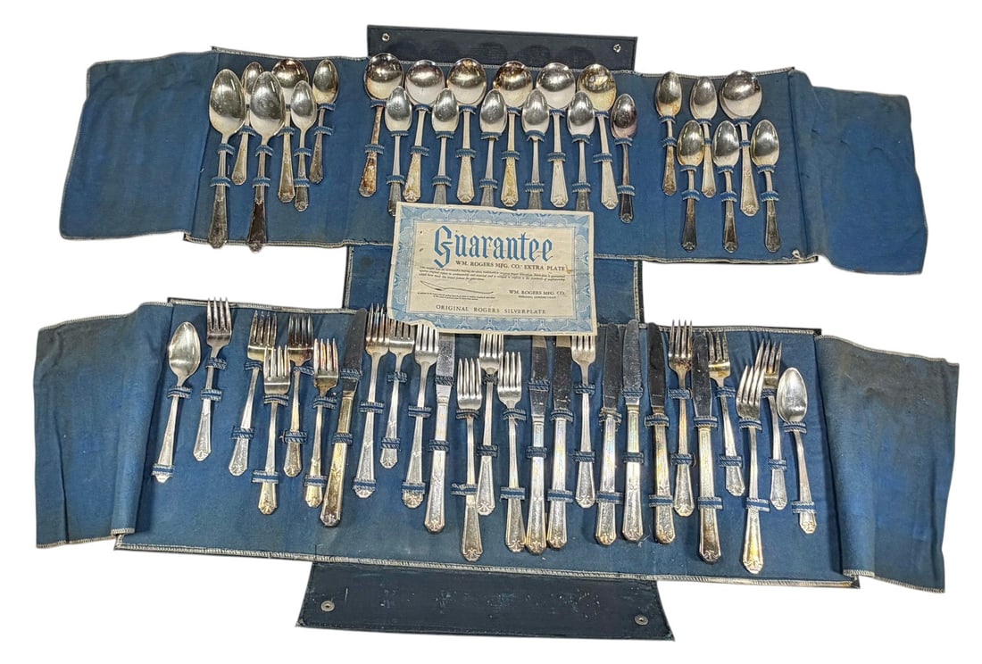 Wm Rogers Silver-plated Flatware Service 50pc LOT: Wm. Rogers Mfg. Co. 'Extra Plate' flatware service, 50-piece set, presented in fitted case with original paperwork. Includes assorted forks, knives, and spoons in a matching pattern. Marked 'Wm. Roger