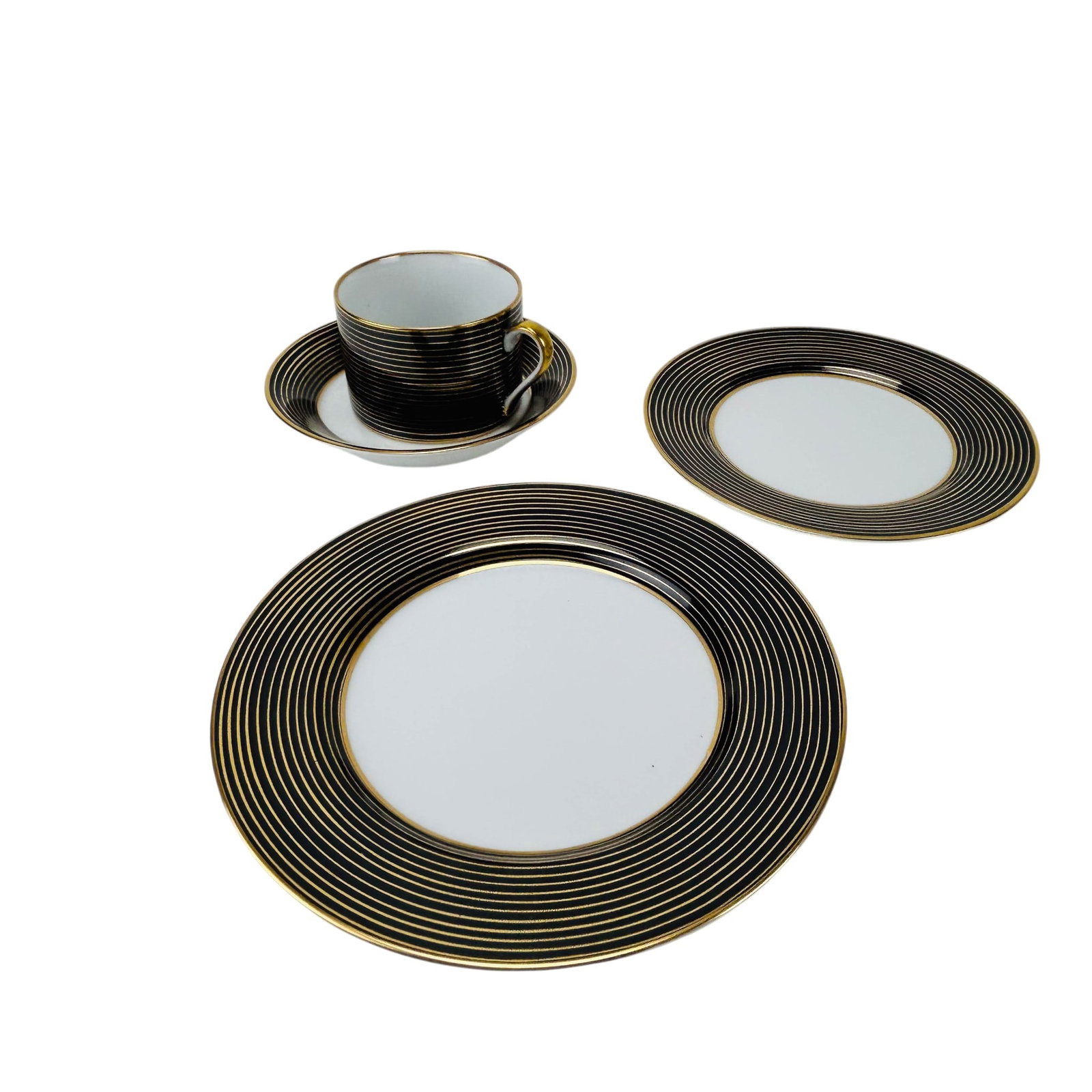 Fitz Floyd Rondelle Black Cup Saucer Plate 59p LOT: Fitz and Floyd porcelain Rondelle pattern, partial service total of fifty nine pieces. Production years 1987-1994. Includes twelve flat cups, twelve bread and butter plates, twelve fruit or cereal bow