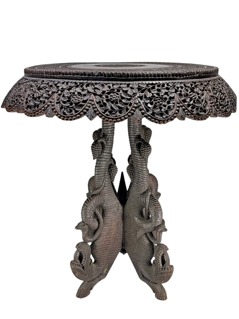 Anglo-Indian Carved Rosewood Cobra Table, 19th C: Anglo-Indian carved rosewood table, 19th century, circular top with dense floral and foliate carving and pierced apron, base formed by intertwined cobra figures with detailed scales, rich dark patina,