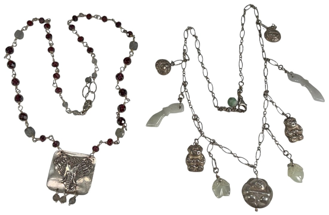 Sterling Silver 925 Pendant Necklaces 2pc LOT: Group of two sterling silver pendant necklaces. One example features faceted stones in violet and greenish tones with an elephant motif pendant. The second necklace includes jade details with assorted