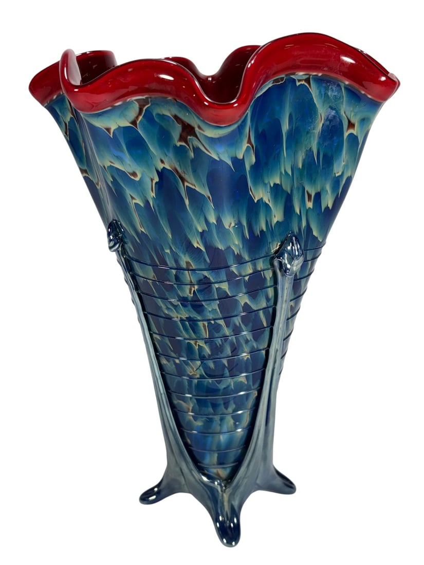 2008 Hand Blown Art Glass Trumpet Vase, SIGNED: Hand blown art glass vase with flared scalloped rim in ruby red over mottled blue and cream body. Vase features applied vertical clear blue trailing and four-point footed base with engraved signature 