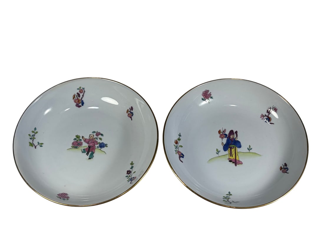 Herend Hungary Chinese Style Porcelain 2pc LOT: Herend Hungary hand-painted porcelain comprising 2 pieces in Chinese style. Each bowl features a central figural scene with oriental-inspired decoration, scattered floral sprigs, and gilt rim