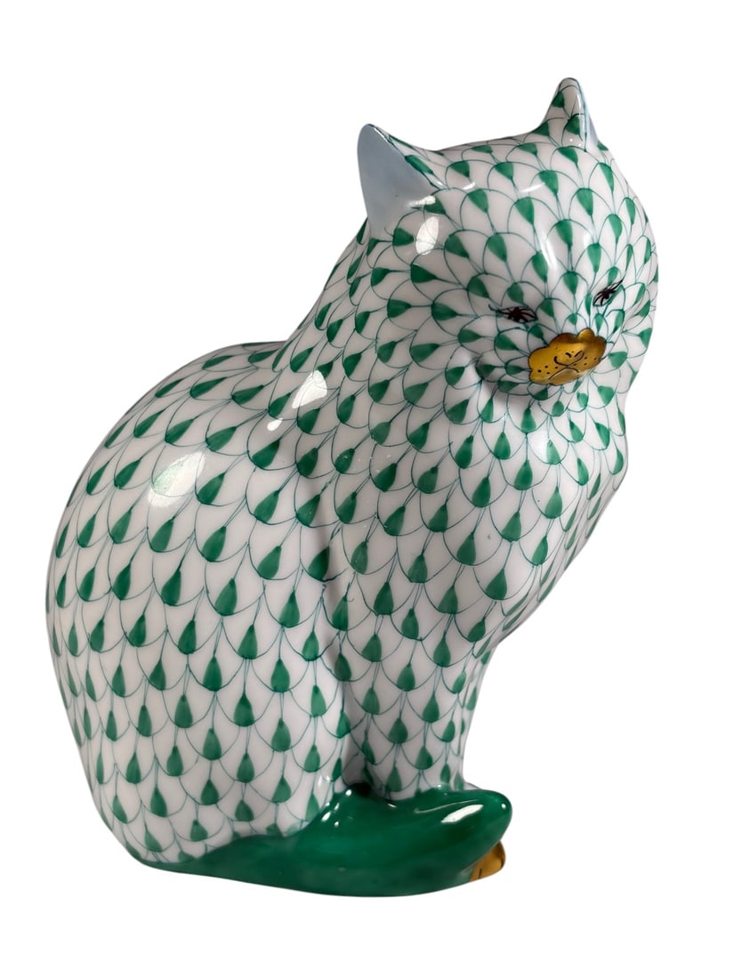 Herend Hungary Green Fishnet Porcelain Sitting Cat: Herend Hungarian hand-painted porcelain figure depicting a seated cat in the green fishnet pattern with gilt accents to facial details and paws. Marked Herend Hungary Handpainted on underside, model