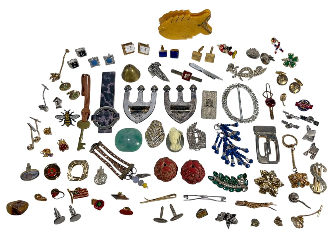 Assorted Vintage Costume Jewelry Accessory 83pcs: Assorted vintage accessory lot including pins, tie clips, cufflinks, brooches, keychains, belt buckles, and novelty pieces in mixed metals and materials. Features rhinestones, enamel, carved accents, 