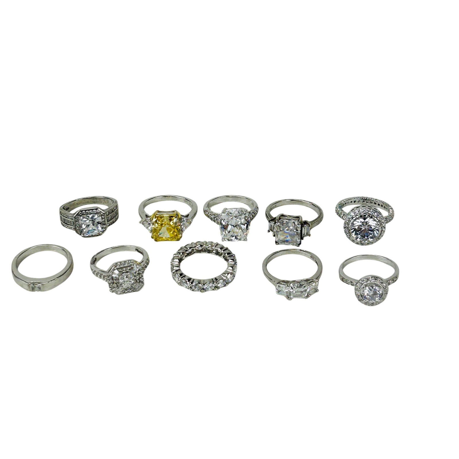 Sterling Silver 925 Women's Rings 10pc Estate LOT: Assorted sterling silver fashion rings featuring cubic zirconia stones in solitaire, halo, eternity, and geometric settings. Lot includes cushion, emerald, round, and radiant cut examples with white a