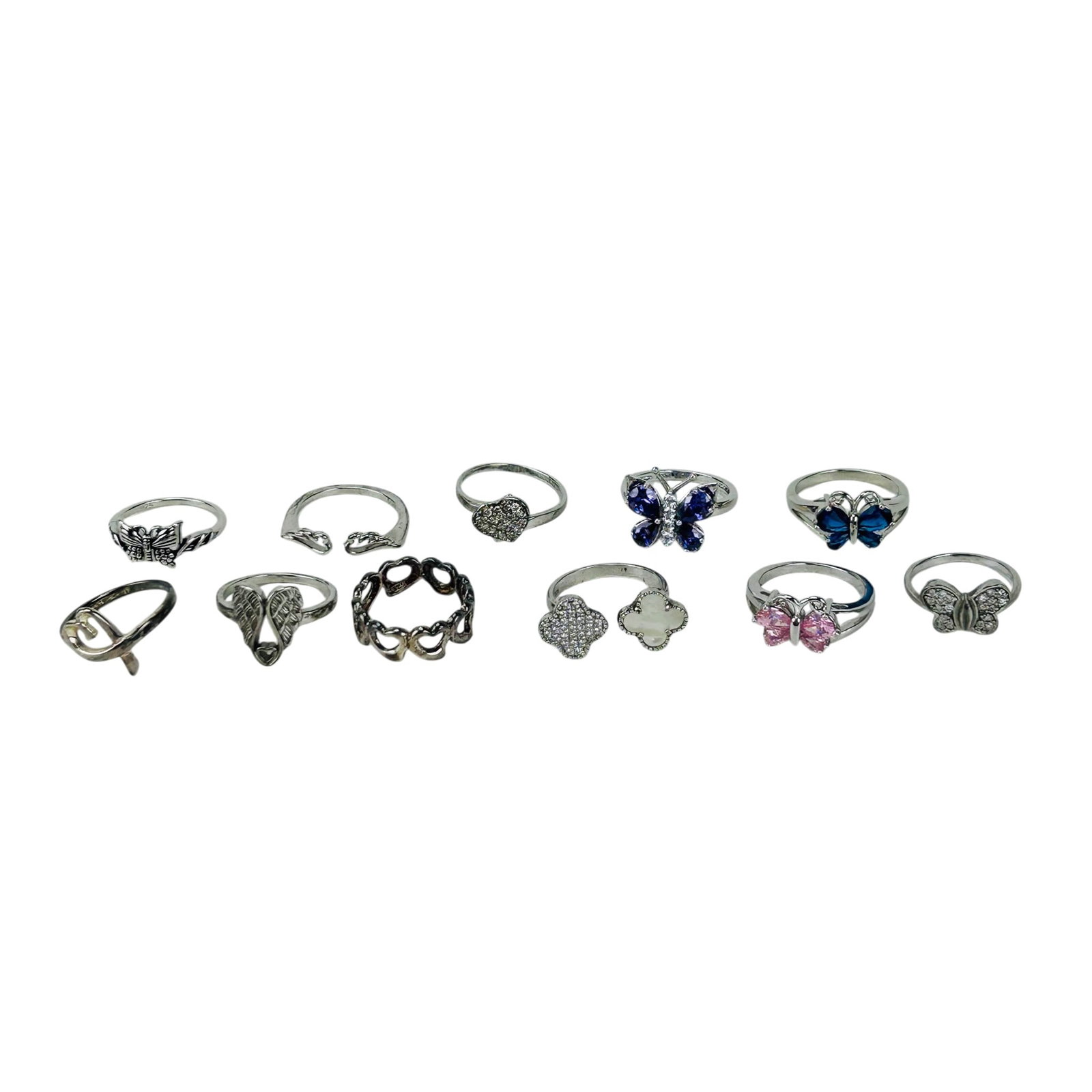 Sterling Silver 925 & Gemstone Assorted Ring 11pc: Group of sterling silver 925 fashion bands featuring butterfly, heart, angel wing, floral, clover, pave, and openwork motifs. Examples include purple, pink, blue, and clear stone settings with cubic z
