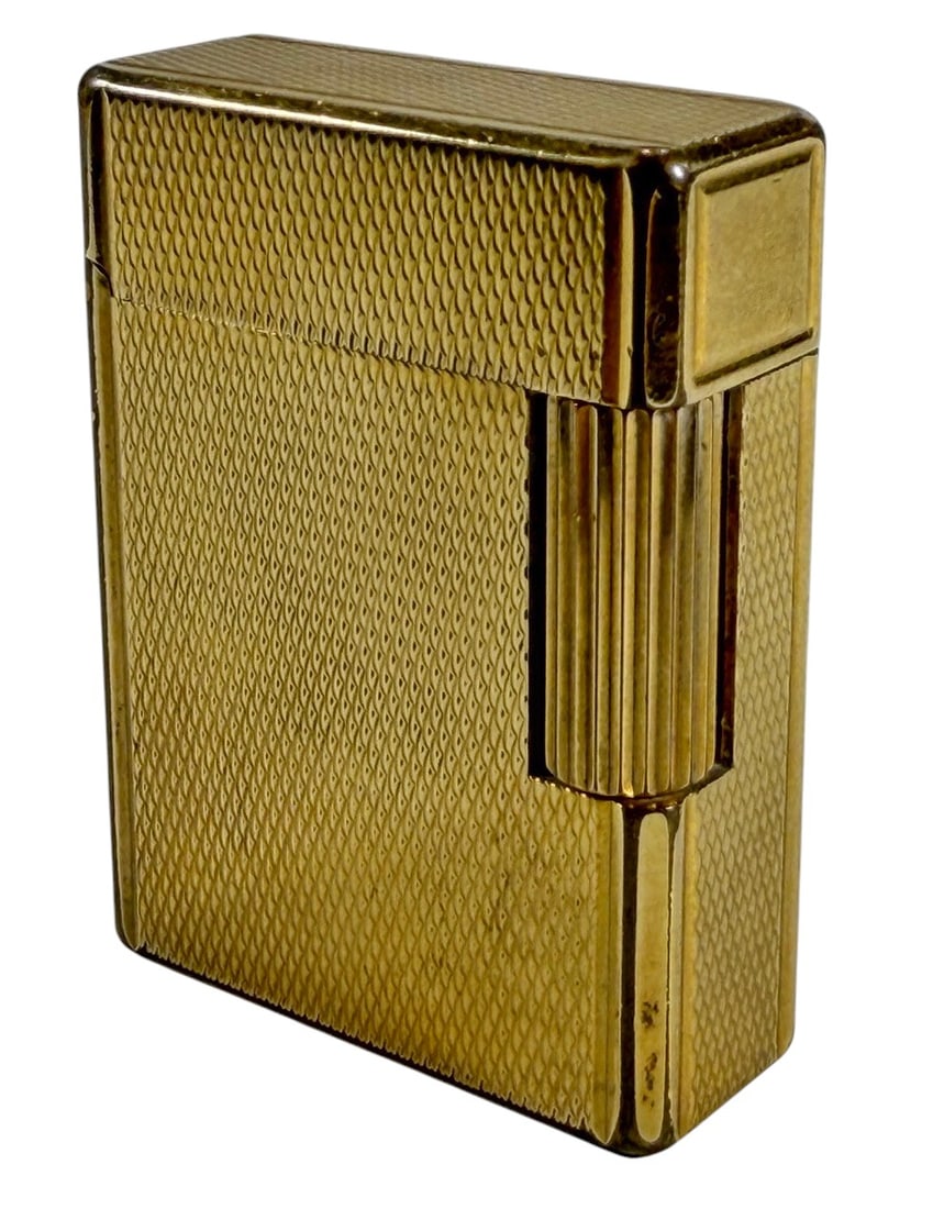 Vintage S.T. Dupont Ligne 1 Gold-tone Lighter: Vintage S.T. Dupont Ligne 1 lighter in gold-tone finish with textured diamond-pattern exterior. Marked S.T. Dupont Paris Made in France and stamped 20 indicating 20 micron gold plating. Features side 