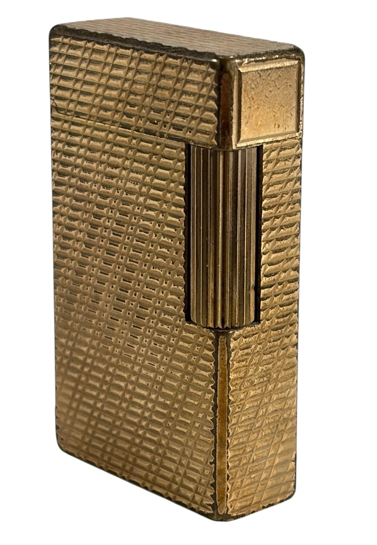 Vintage S.T. Dupont Ligne 1 Gold-tone Lighter: Vintage S.T. Dupont Ligne 1 lighter in gold-tone finish with textured geometric engraved pattern. Marked S.T. Dupont Paris Made in France. Features side roller ignition and hinged lid. Compact French 