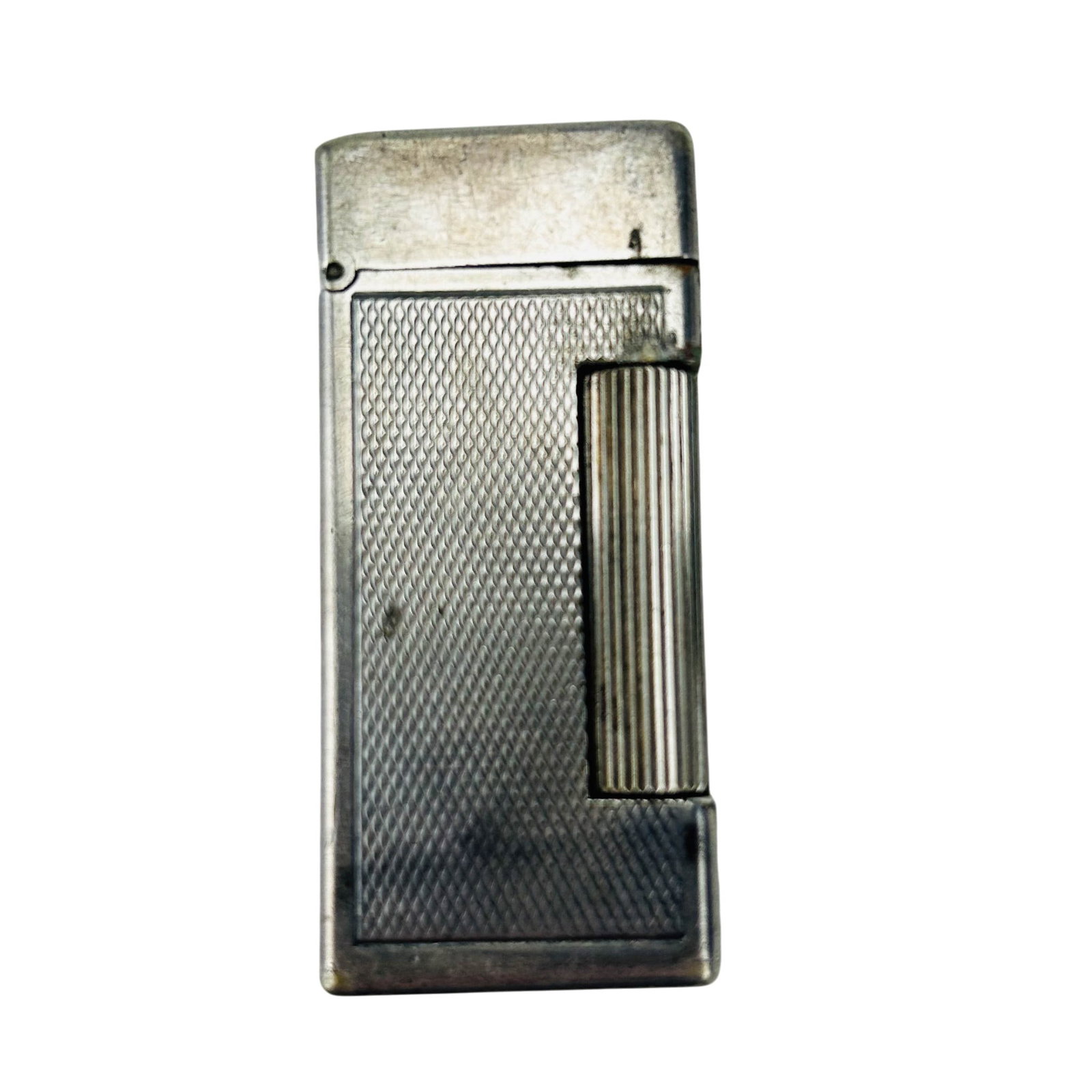 Dunhill London Silver Tone Rollalite Swiss Lighter: Alfred Dunhill Rollalite pocket lighter with silver tone metal body and textured engine turned panels. Rectangular form with ribbed side roller striker and hinged lid. Lid engraved D.I.M. to top. Base