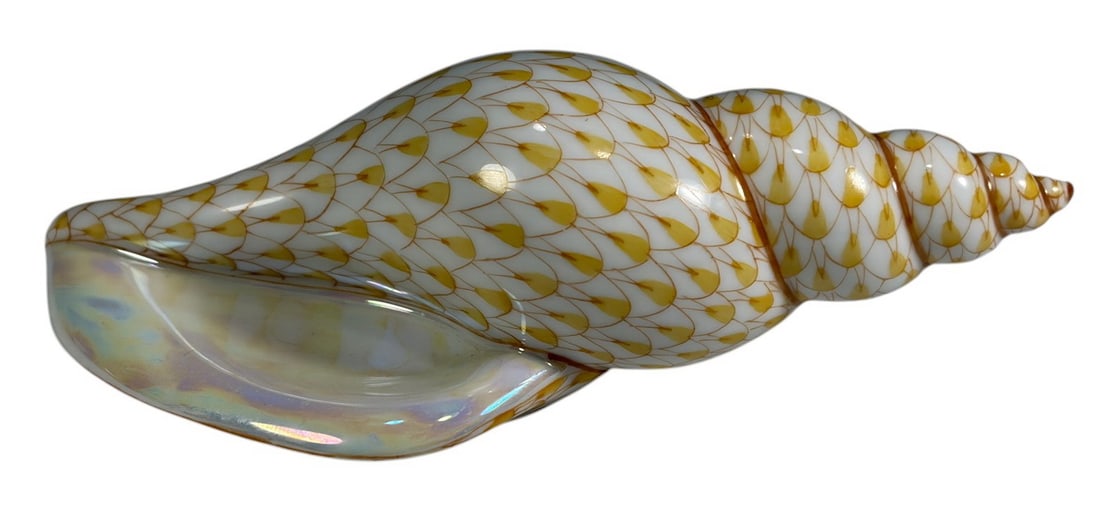 Herend Hungary Sea Snail Fishnet Porcelain Figure: Herend Hungarian hand-painted porcelain sea snail figurine, model no. 15635, decorated in the makers signature gilt/yellow fishnet pattern with iridescent shell opening. Marked to underside with Heren