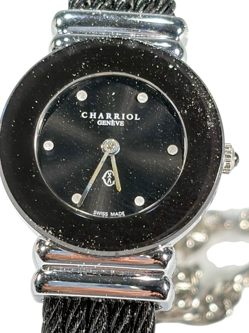 Charriol St Tropez Diamond Black Dial Wristwatch: Ladies Charriol St Tropez Swiss made quartz wristwatch with black dial accented by diamond hour markers and stainless steel cable style bracelet. Features signature Charriol twisted cable design with 