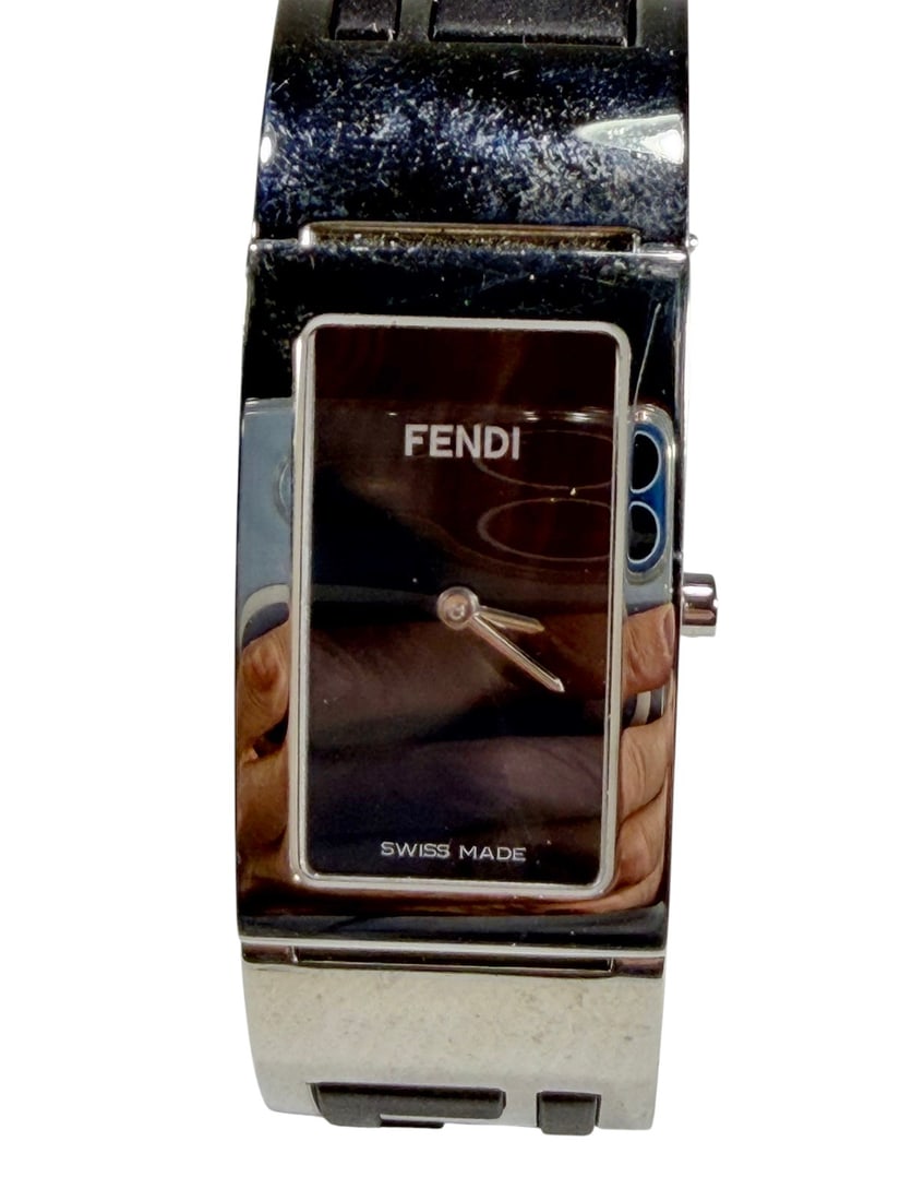 Fendi 3250L Stainless Steel Logo Cuff Wristwatch: Ladies Fendi Orologi Swiss made quartz wristwatch with polished stainless steel cuff bracelet featuring oversized black enamel FF logo cutout design. Features rectangular black dial with minimalist st