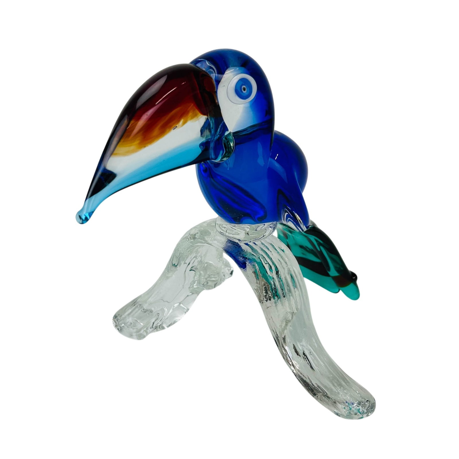 Murano Italy 9" Studio Art Glass Toucan Sculpture: Murano Italian studio hand blown glass sculpture. Depicts this exotic and tropical bird perched on a clear glass branch form base. Modeled with a blue and clear body, multicolor beak, green tail and a