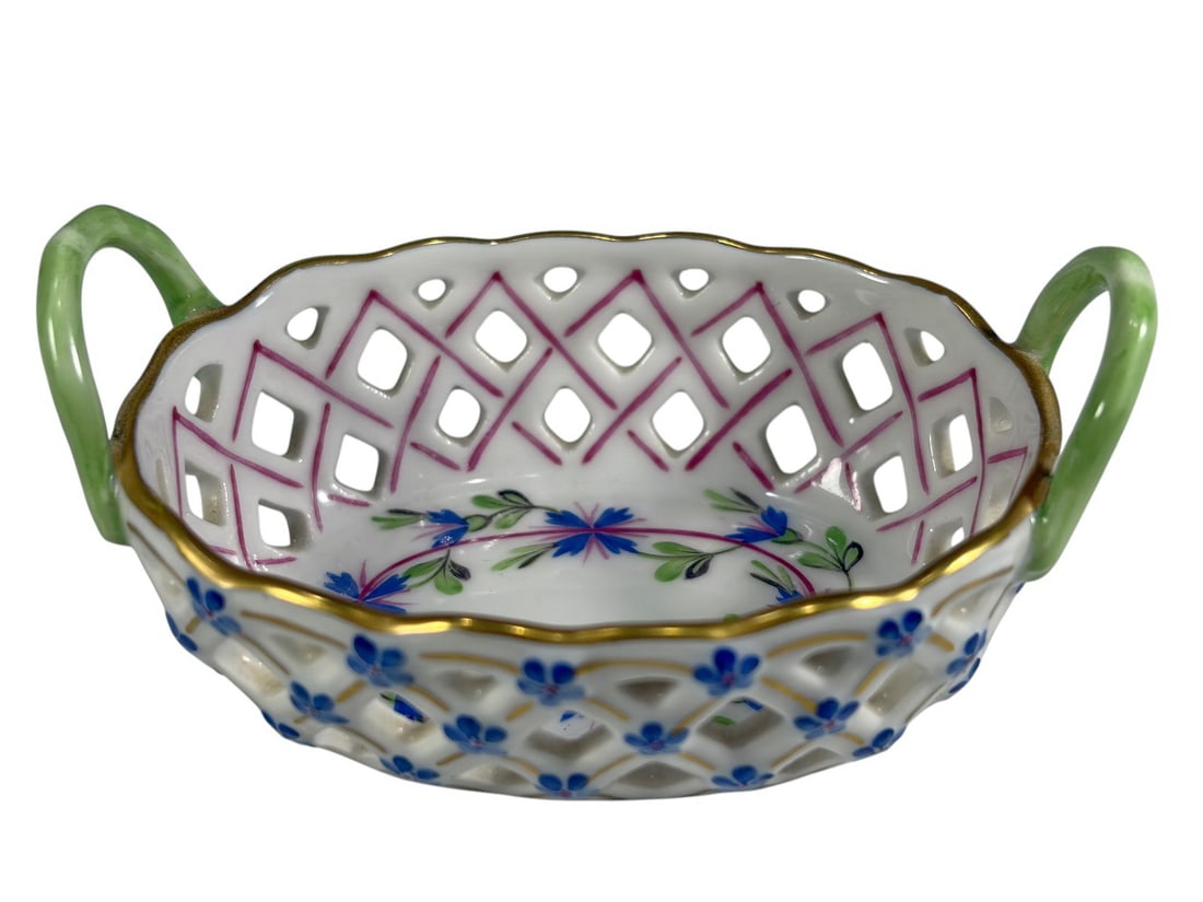 Herend Hungary Porcelain Reticulated Mini Basket: Herend Hungary hand-painted porcelain reticulated miniature basket, pattern 7425/PBG, featuring pierced lattice body, gilt trim, twin green handles, and floral decoration. Marked to underside. Small d