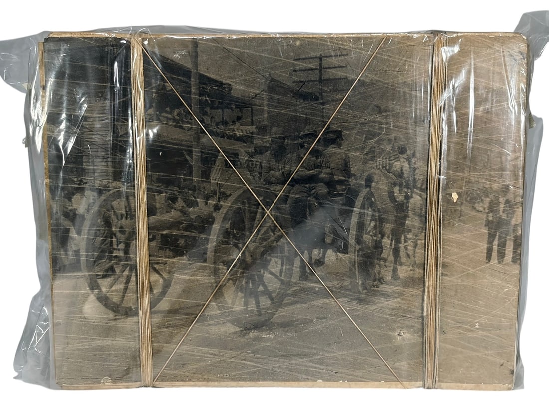 J. M. Fors 'Atado de Memorias' Package, 2000: Mixed media paper assemblage by J. M. Fors from the 'Atado de Memorias' series, composed of bundled photographic image sheets tied with cord and enclosed in plastic wrapping. Dimensions: 12 X 15.5 X 3