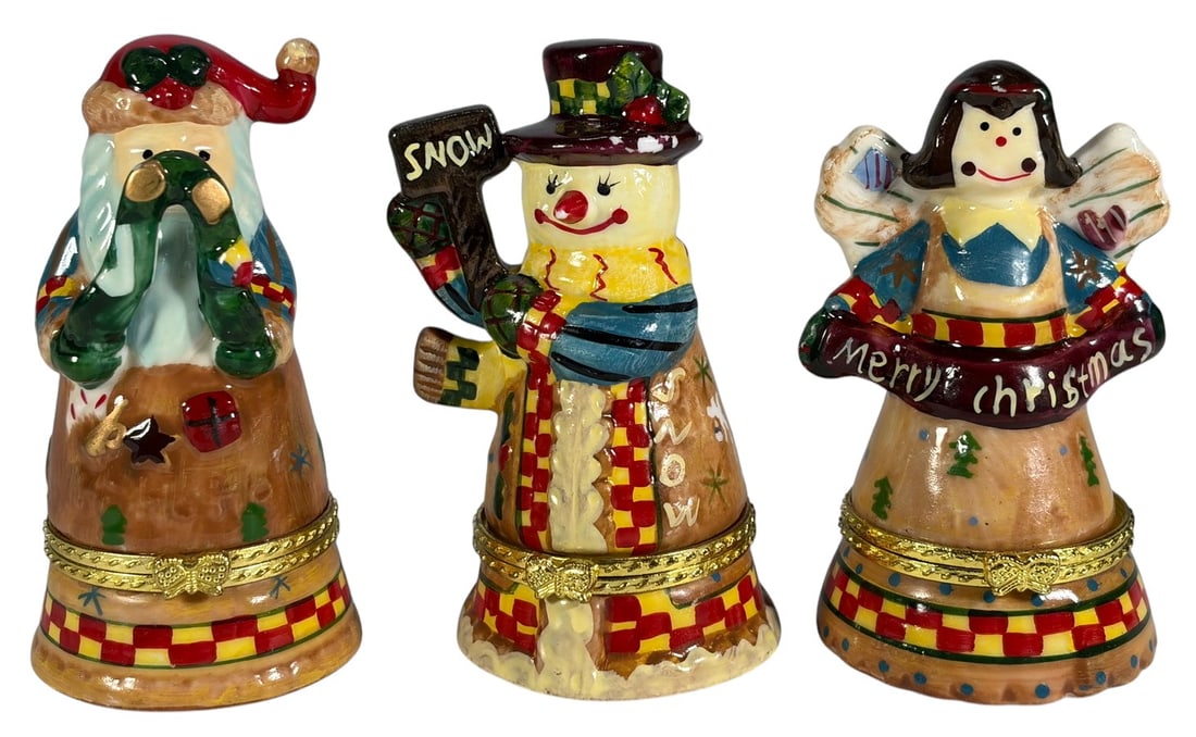 Limoges France Style Christmas Trinket Box 3pc LOT: Group of three hand-painted ceramic Christmas trinket boxes in bell form, including a snowman, angel, and Santa Claus figure. Each features hinged openings with gilt-tone metal mounts and colorful hol