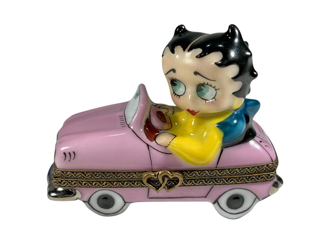 Betty Boop Limoges France Sunday Drive Trinket Box: French Limoges porcelain collector trinket box titled 'Sunday Drive,' featuring Betty Boop seated in a pink convertible automobile. Hinged gilt-tone metal mount with hand-painted figural details and p
