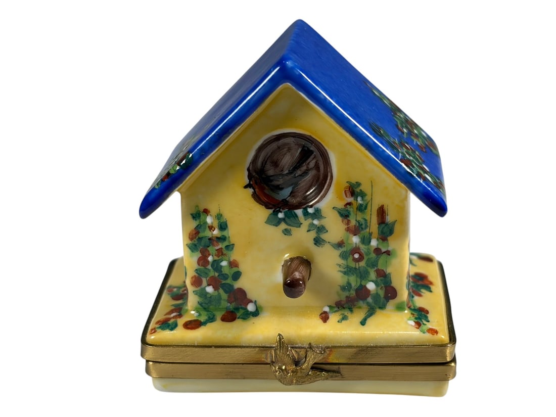 Rochard Limoges Porcelain Birdhouse Trinket Box: Hand-painted Rochard Limoges France porcelain trinket box modeled as a birdhouse, featuring a cobalt blue roof, floral decoration, and bird motif interior. Hinged gilt metal mount with clasp closure. 