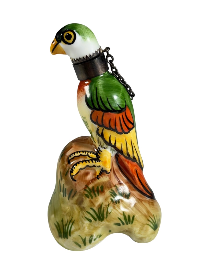 Peint Main Limoges France Parrot Perfume Bottle: Hand painted French Limoges porcelain perfume bottle in the form of a colorful parrot perched on a naturalistic base. Marked Peint Main Chamart Limoges France to underside. Features original figural s